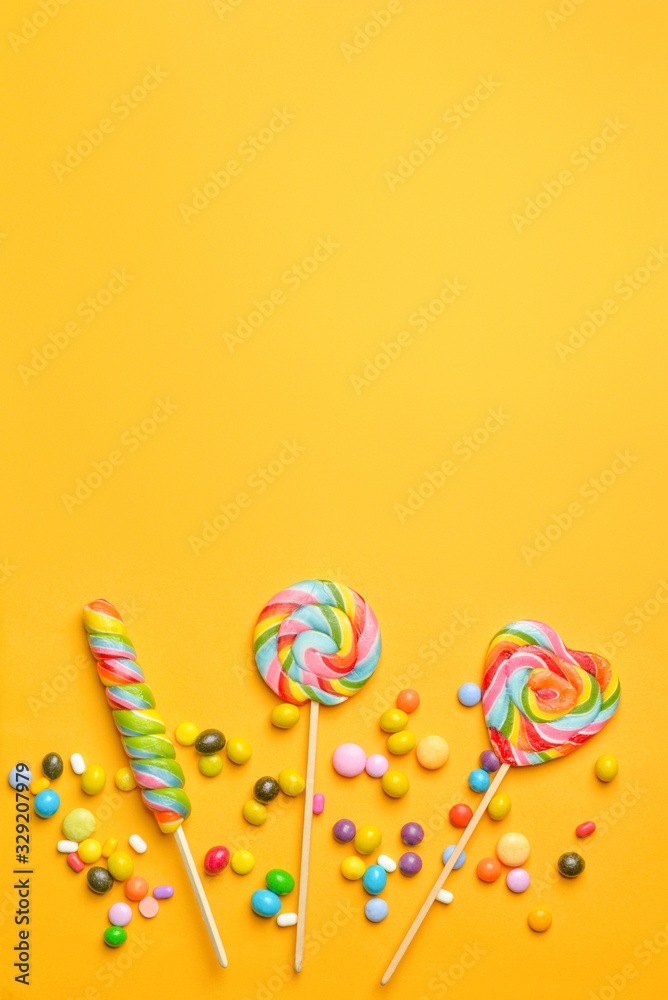 Tasty candies on color background