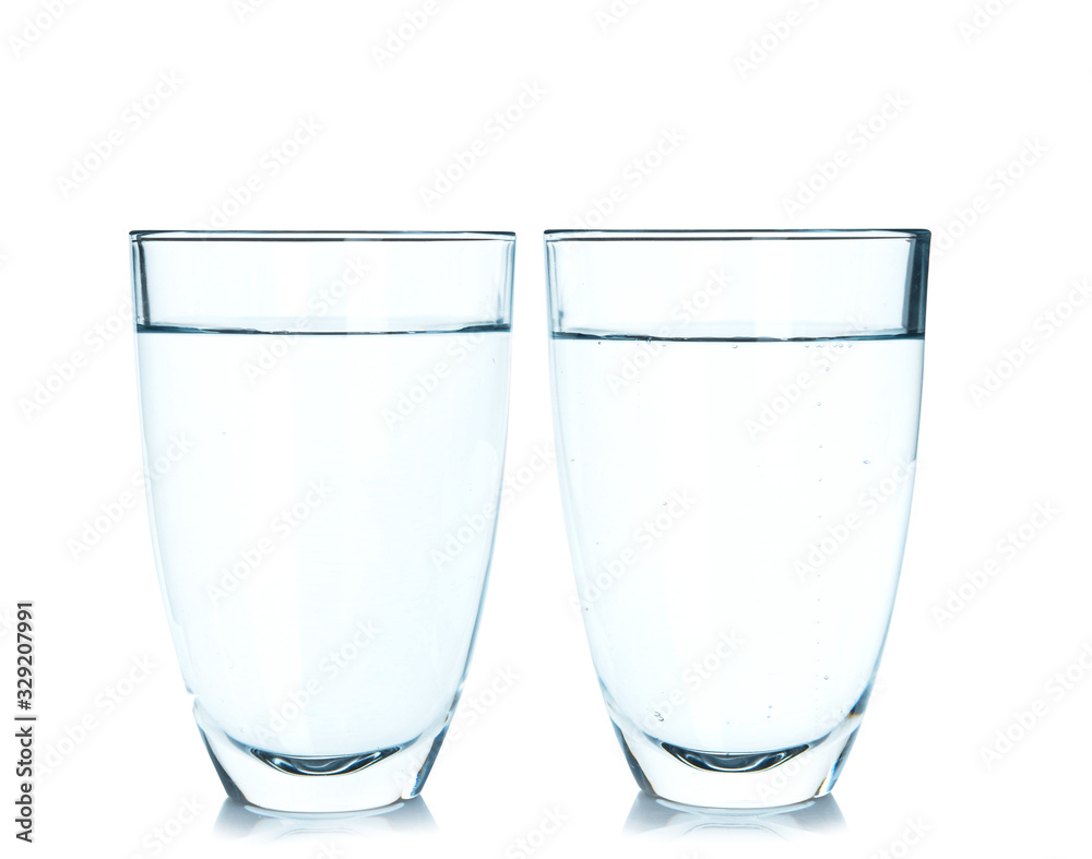 Glasses of fresh water on white background