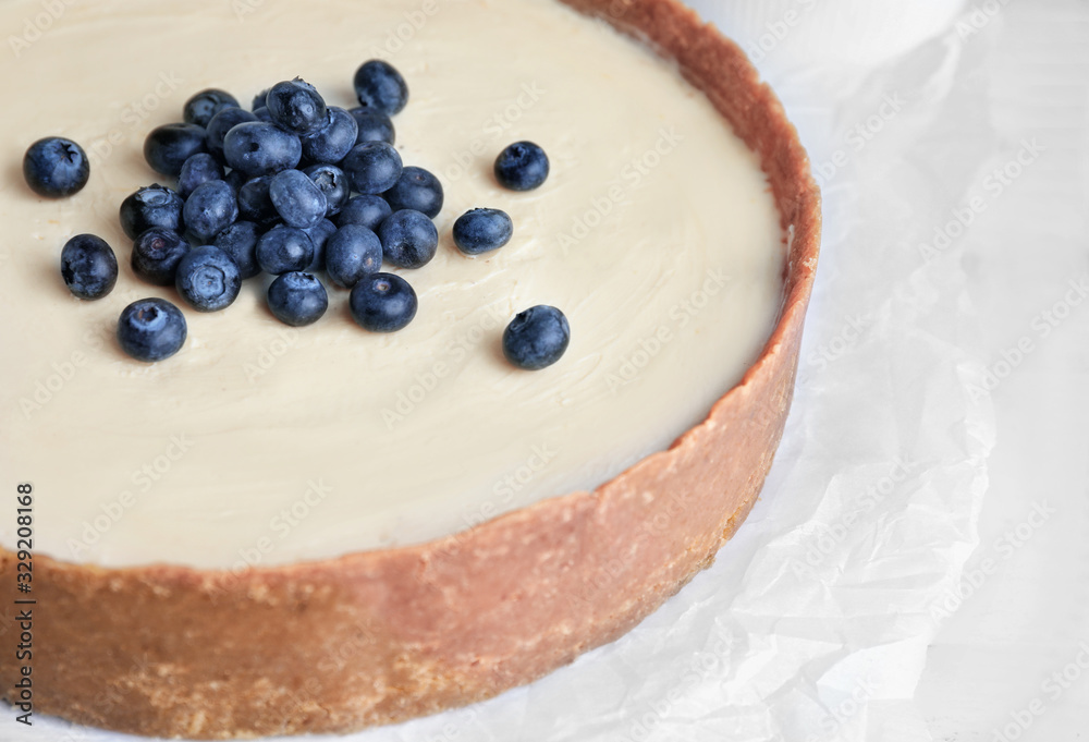 Sweet tasty cheesecake on table, closeup