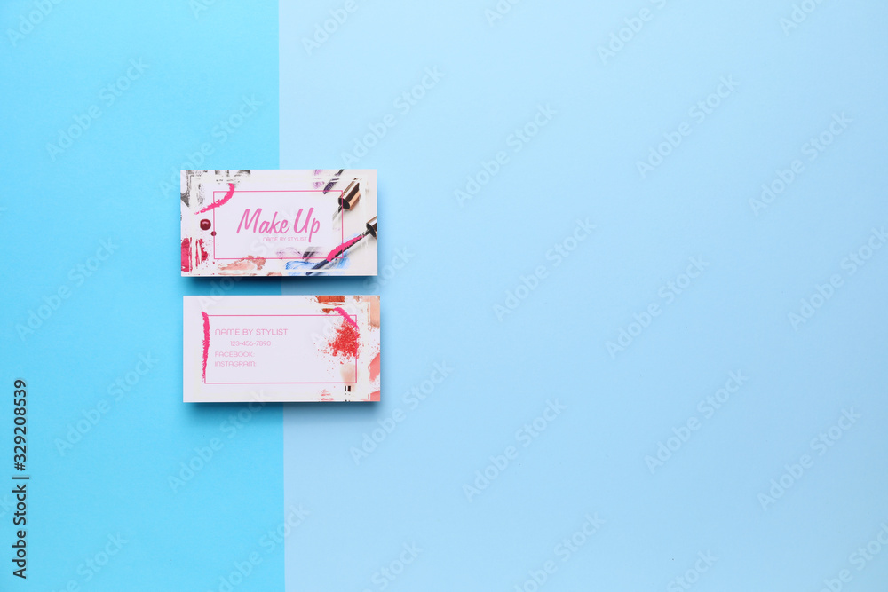 Business cards of makeup artist on color background