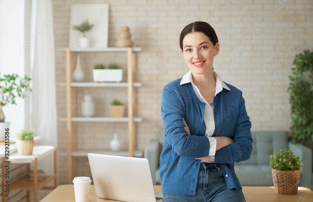 woman working on a laptop at home.