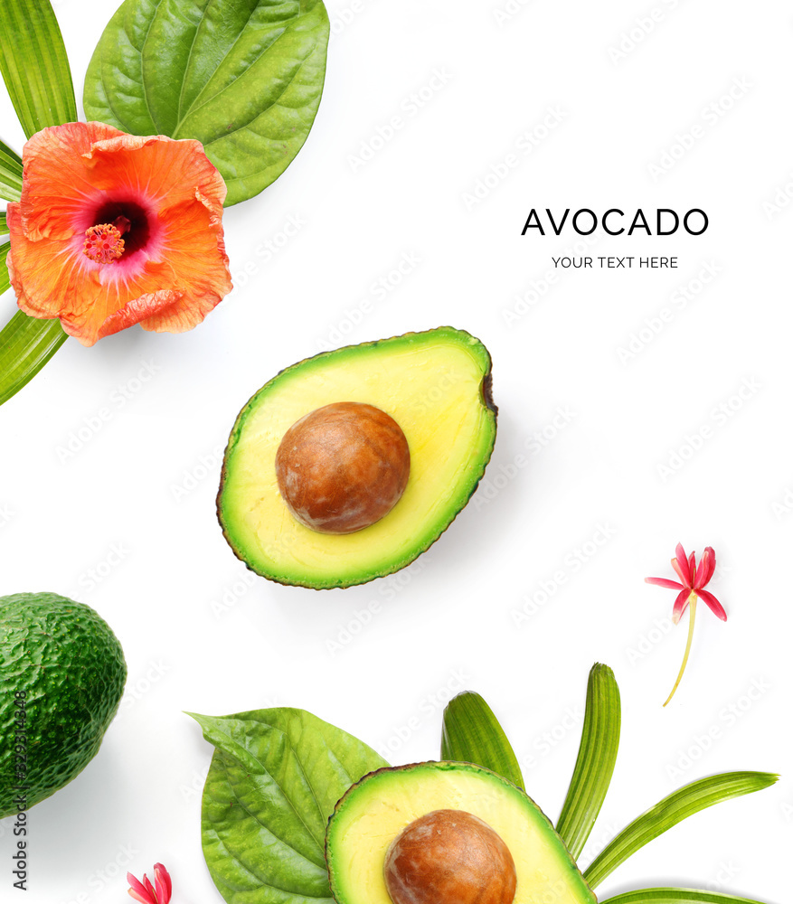 Creative layout made of avocado and tropical leaves and flowers on the white background. Flat lay. F