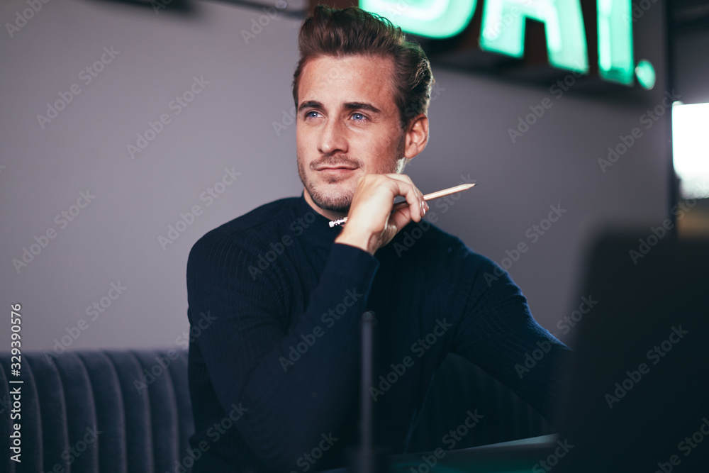 Young businessman deep in thought while sitting in an office