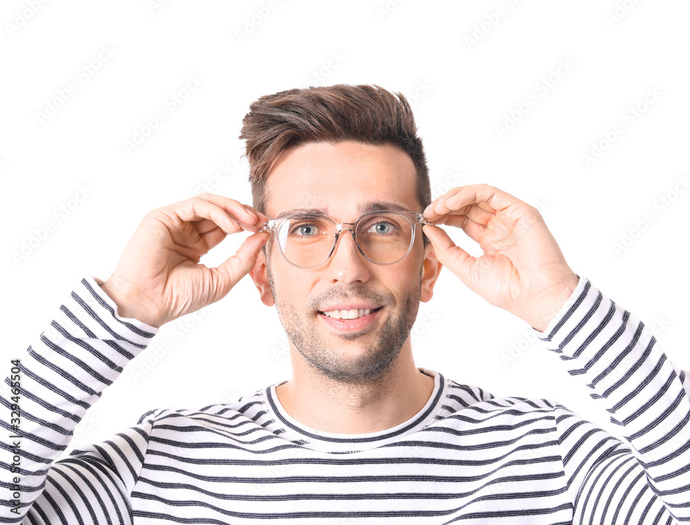 Young man with stylish eyeglasses on white background