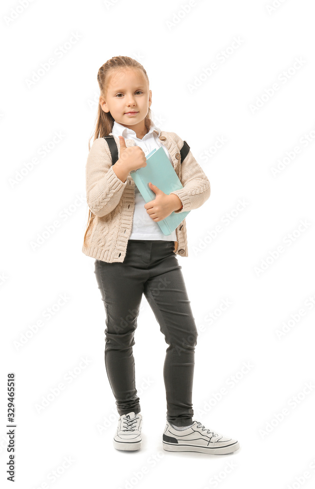 Cute little schoolgirl showing OK gesture on white background