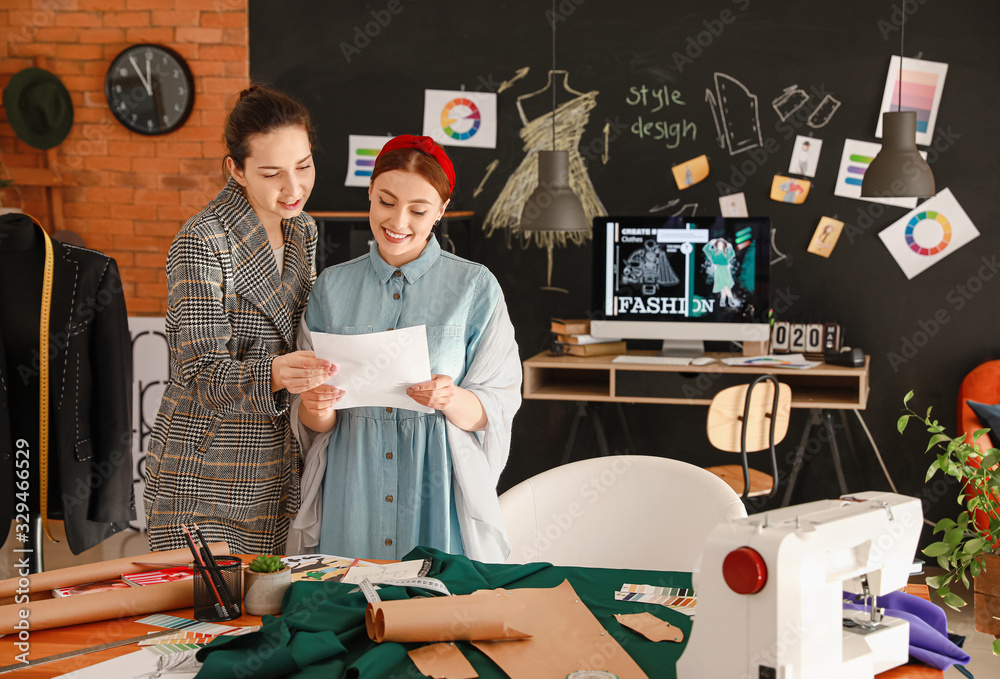 Young women sewing clothes in atelier