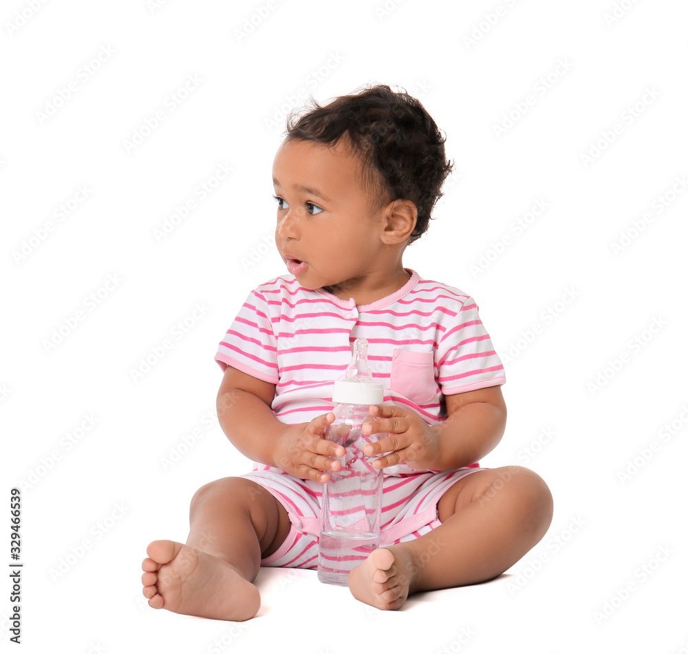 Cute African-American baby with bottle of water on white background