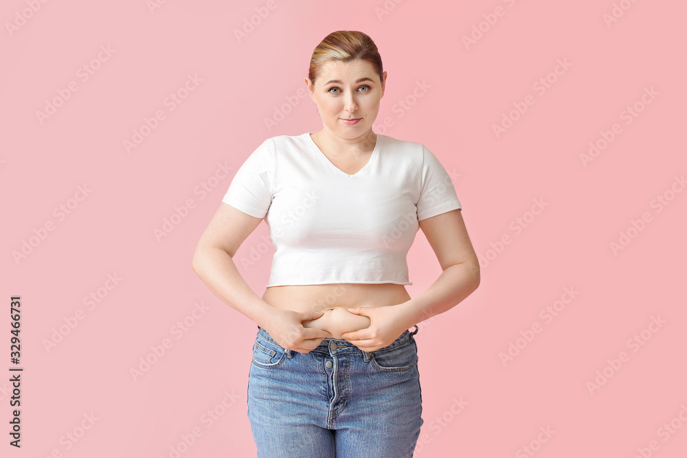 Overweight woman on color background. Weight loss concept