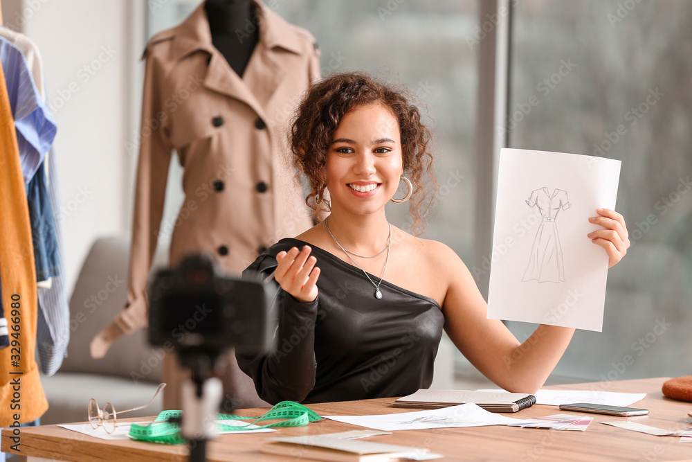 Portrait of female clothes stylist in office