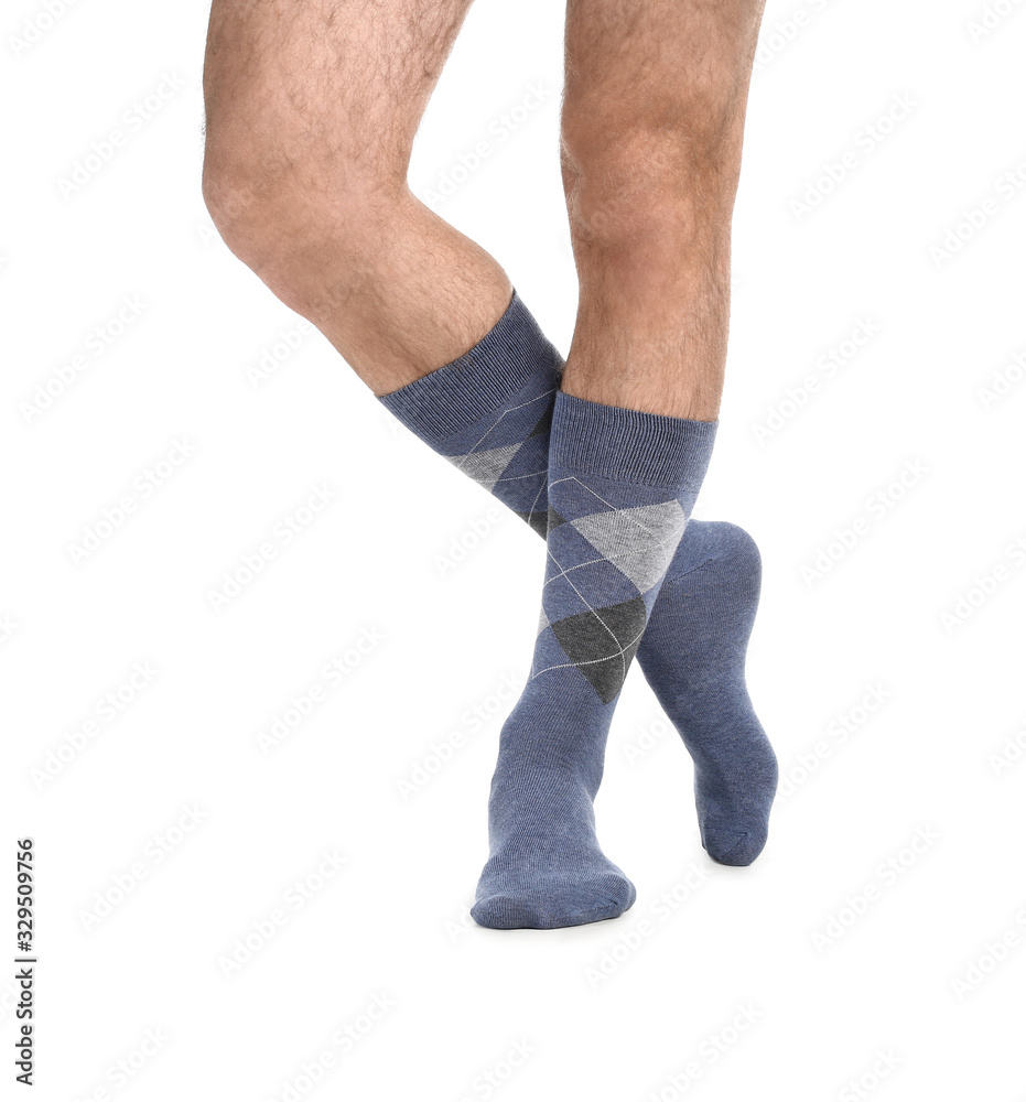 Male legs in socks on white background