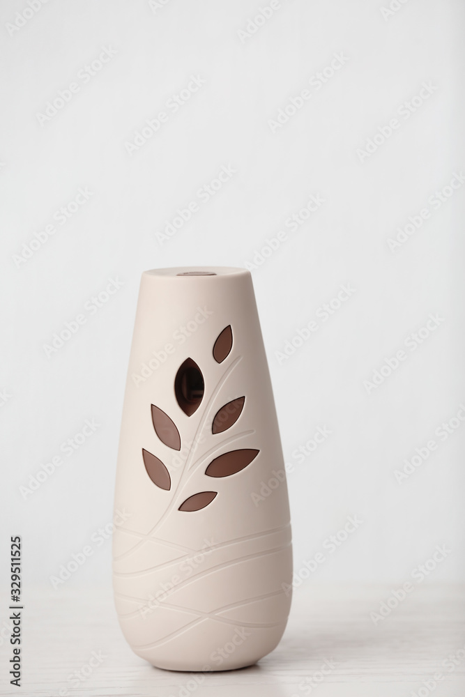 Modern air freshener on light background