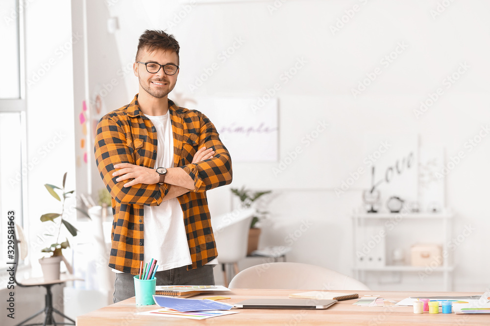 Male interior designer working in office