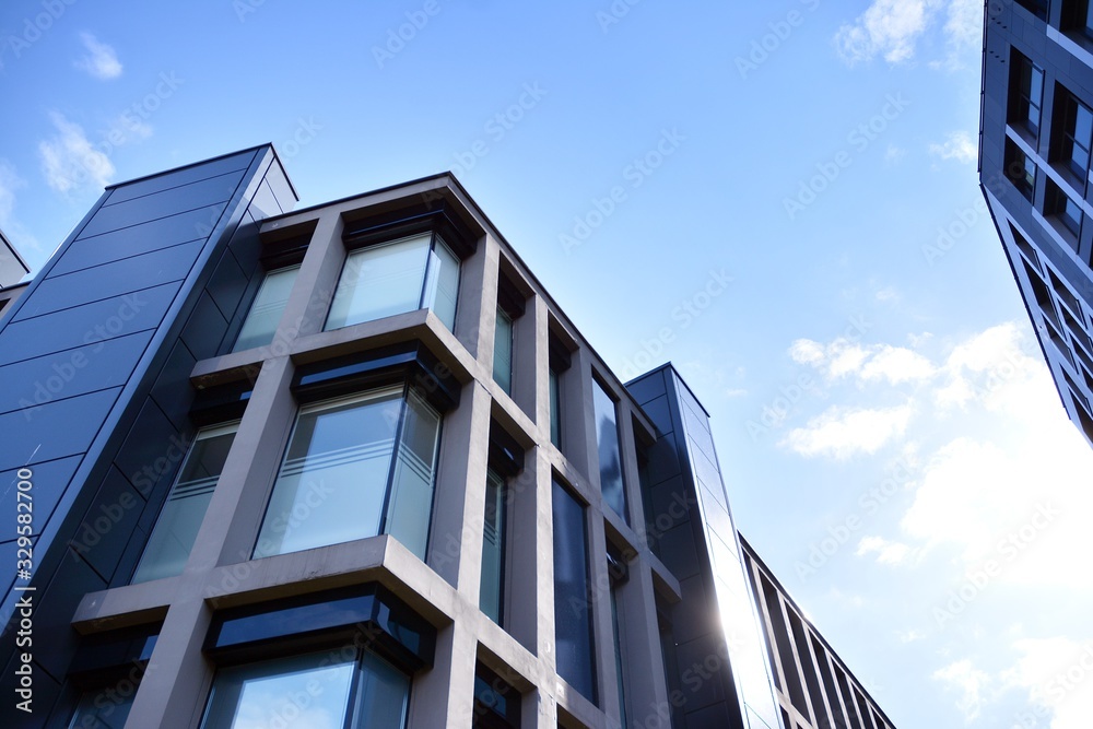 Modern office building facade abstract fragment, shiny windows in steel structure