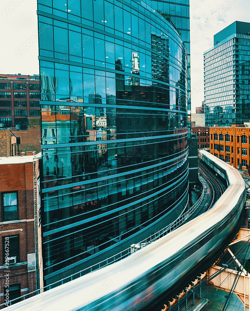 An elevated train curving through Downtown Chicago