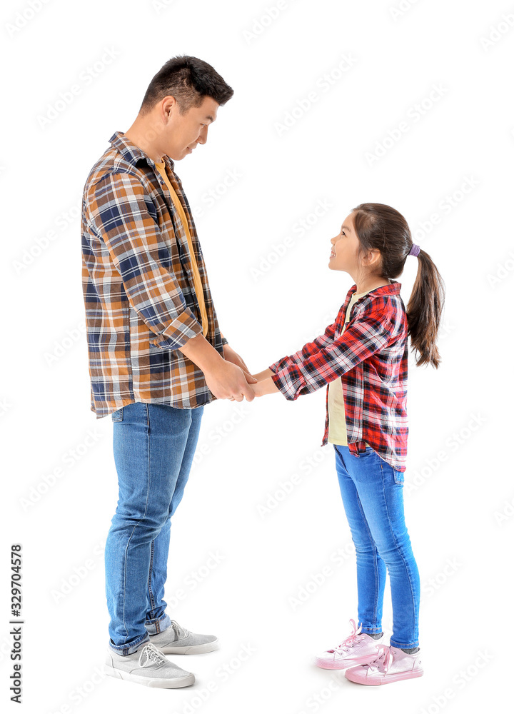 Happy Asian man and his little daughter on white background