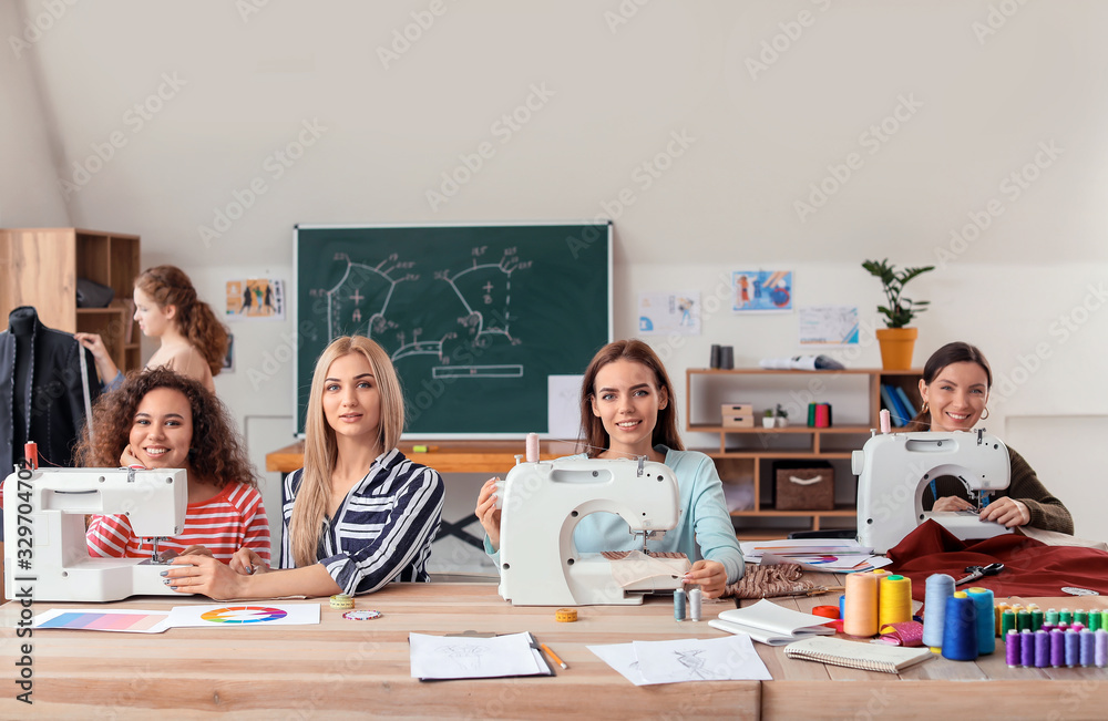 Young women during tailors class in atelier