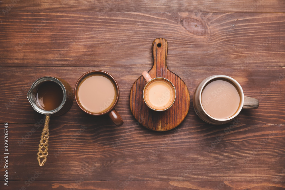 Composition with hot coffee on wooden background