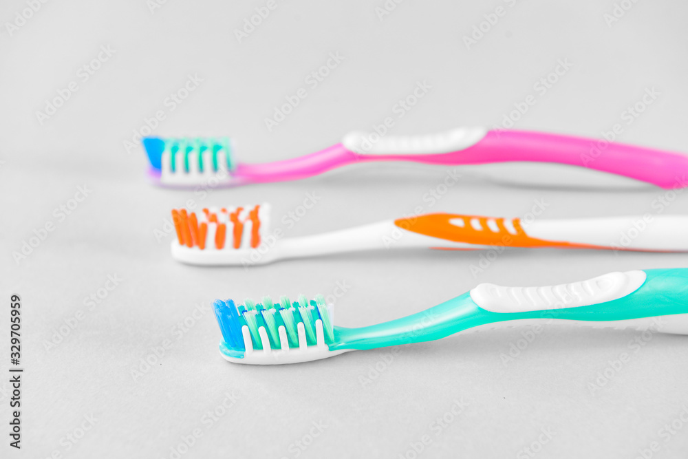 Tooth brushes on light background