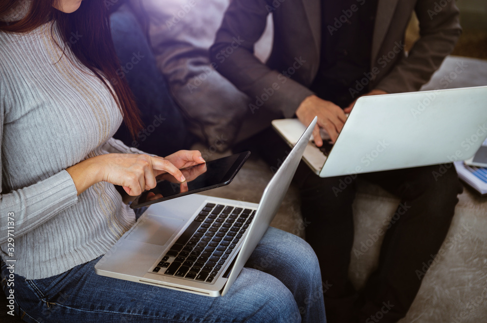 Businessman making presentation with his colleagues and business tablet digital computer at the offi