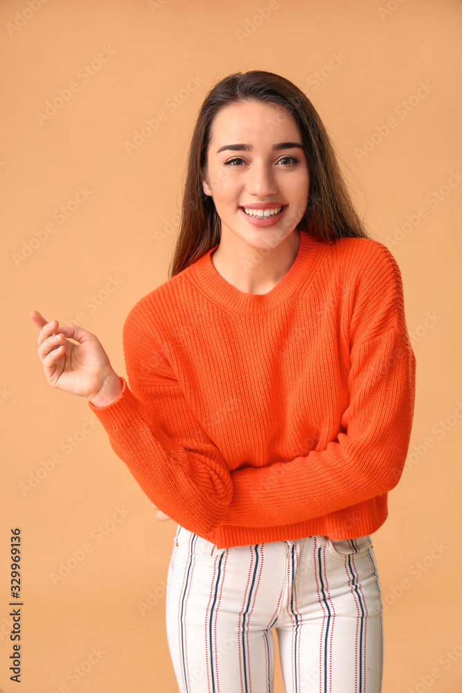 Stylish young woman on color background