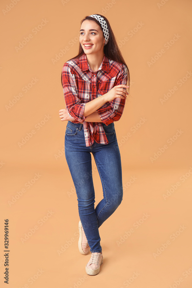 Stylish young woman on color background