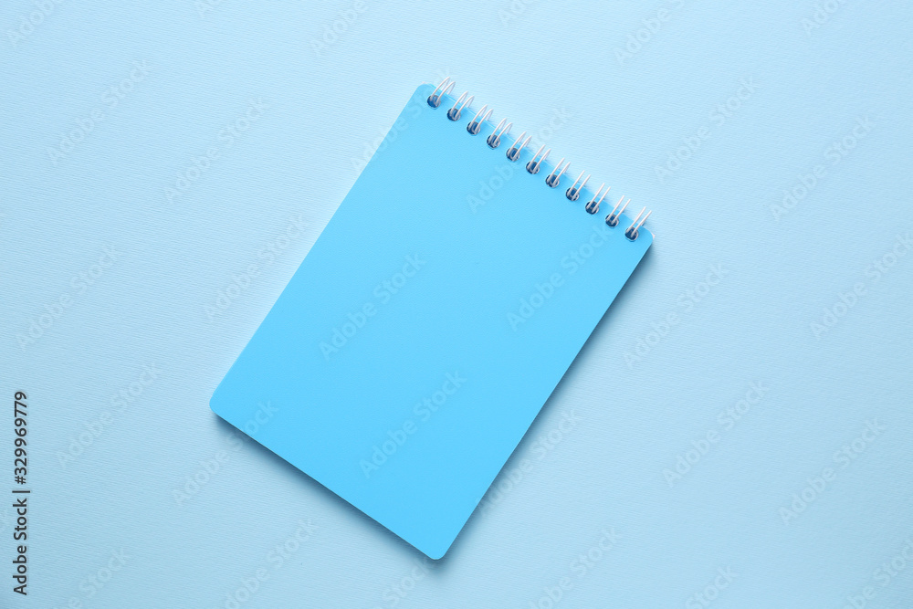 School notebook on color background