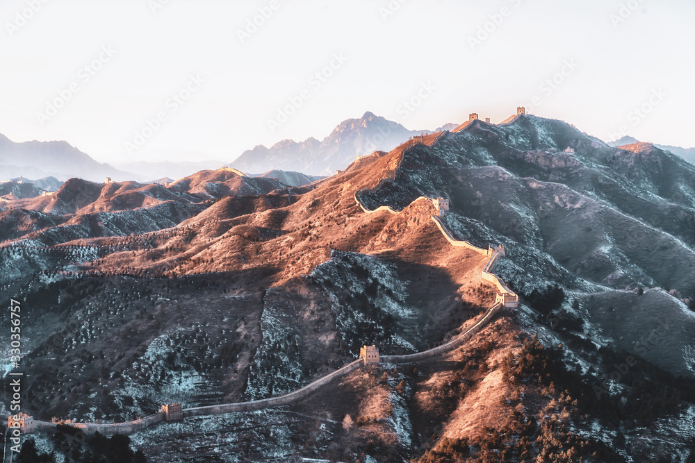 Panoramic view of the beautiful wall of china under the evening sun