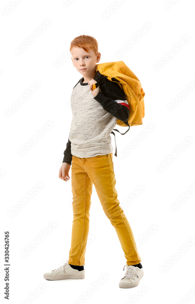 Cute little boy with backpack on white background