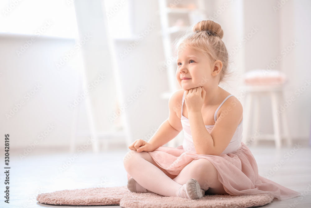 Cute little ballerina at home