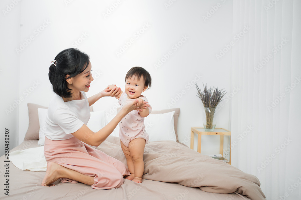 Happy loving family. Mother and her daughter child girl playing