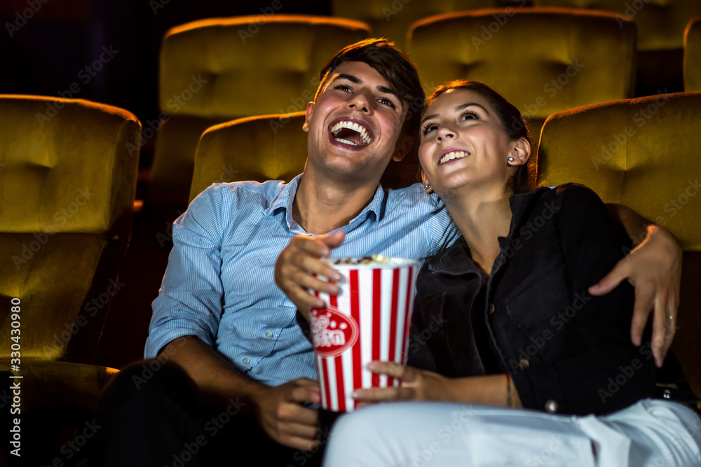 People audience watching movie in the movie theater cinema. Group recreation activity and entertainm