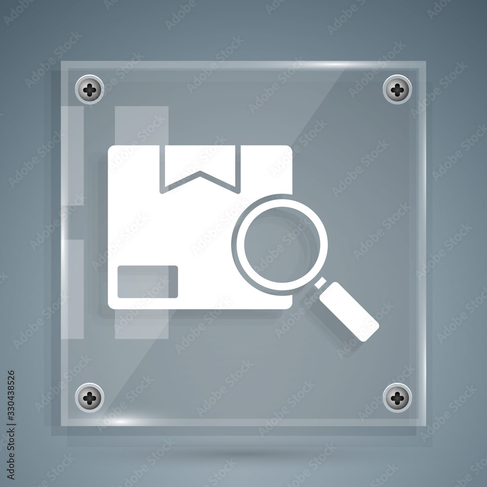 White Search package icon isolated on grey background. Parcel tracking. Magnifying glass and cardboa