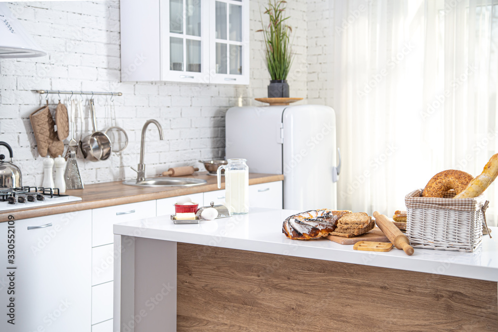 Home kitchen interior with fresh pastries on the table.