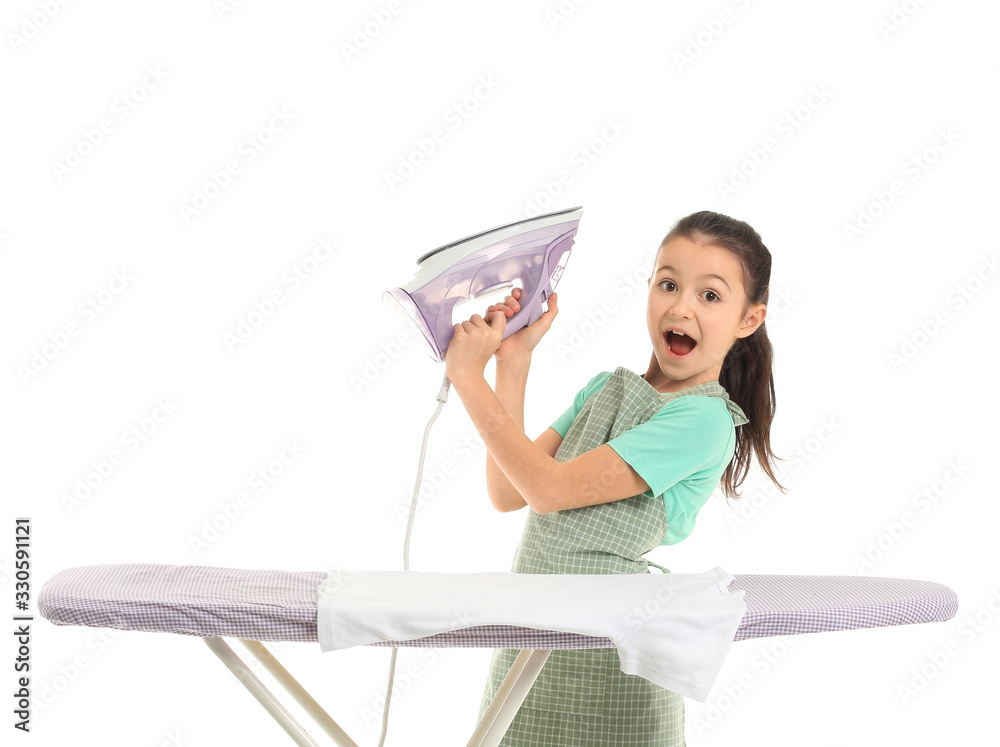 Little housewife with iron and clothes on board against white background