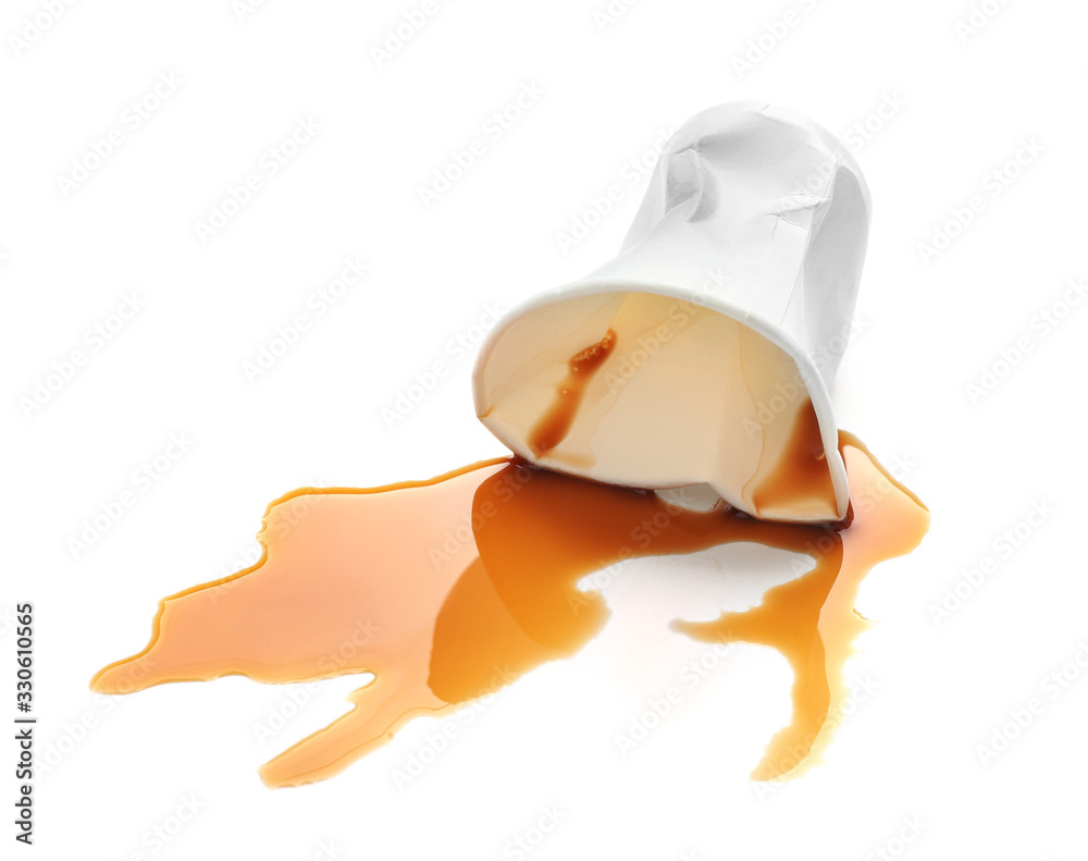 Overturned paper cup and spilled coffee on white background