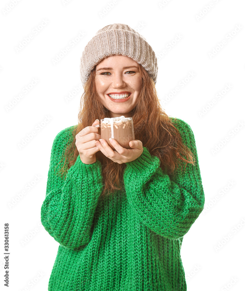 Beautiful young woman with cup of hot cocoa on white background