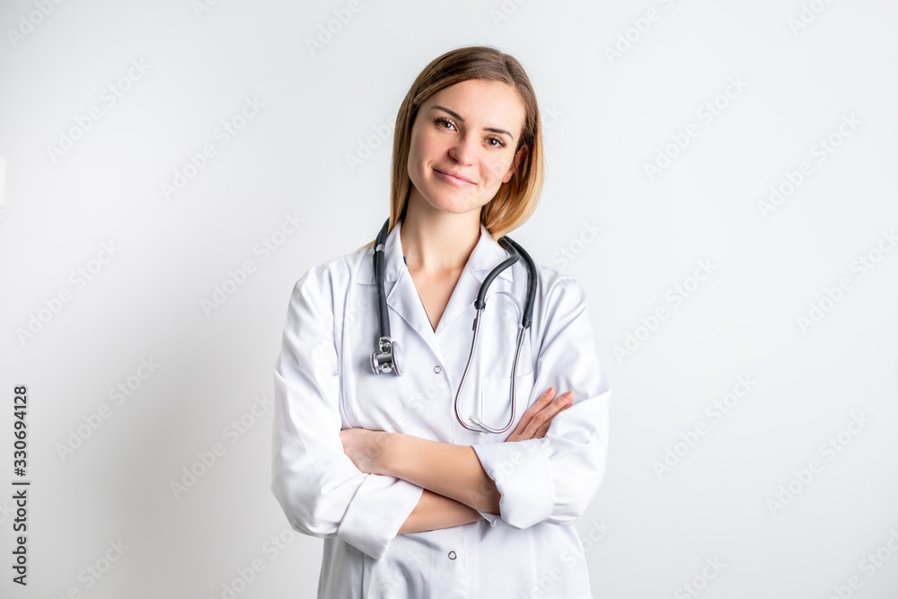 Medical concept of young female doctor in white coat with stethoscope