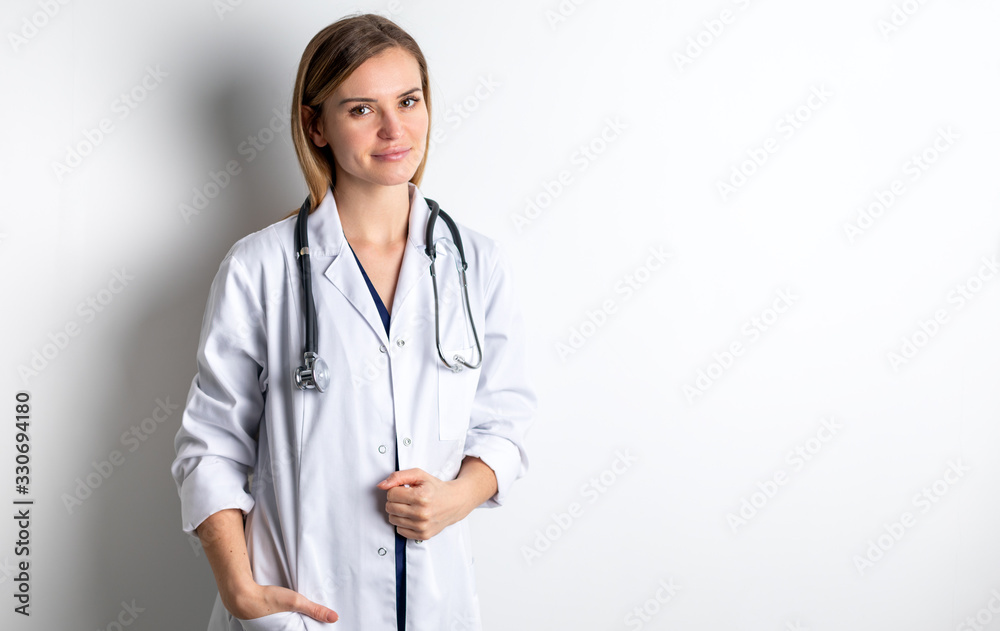 Medical concept of young female doctor in white coat with stethoscope