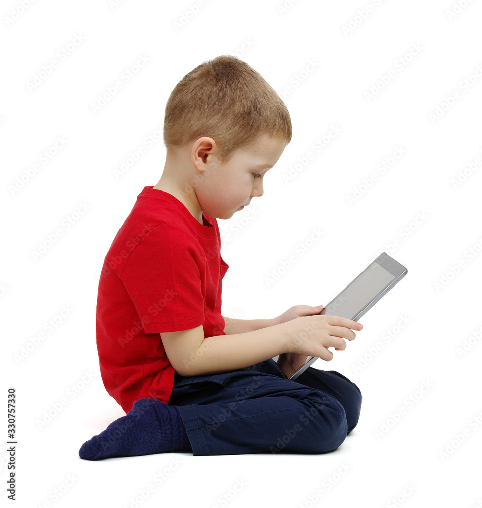 little boy looking at digital tablet computer