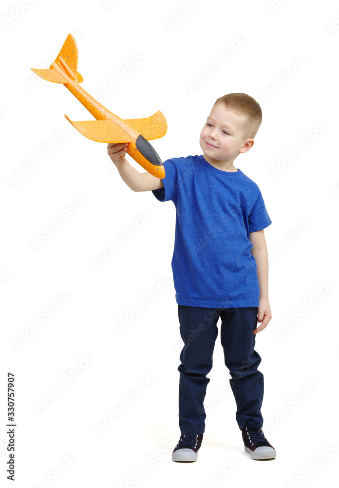 Little boy playing with a toy airplane.