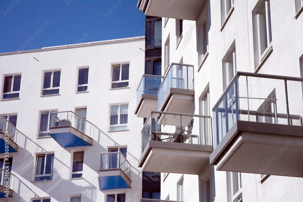 Modern and new apartment building. Multistoried modern, new and stylish living block of flats.