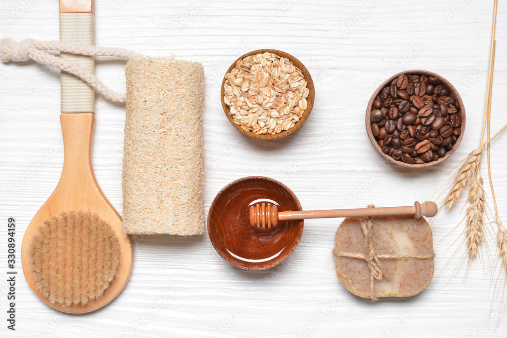 Bath items, honey and ingredients for scrub on white table