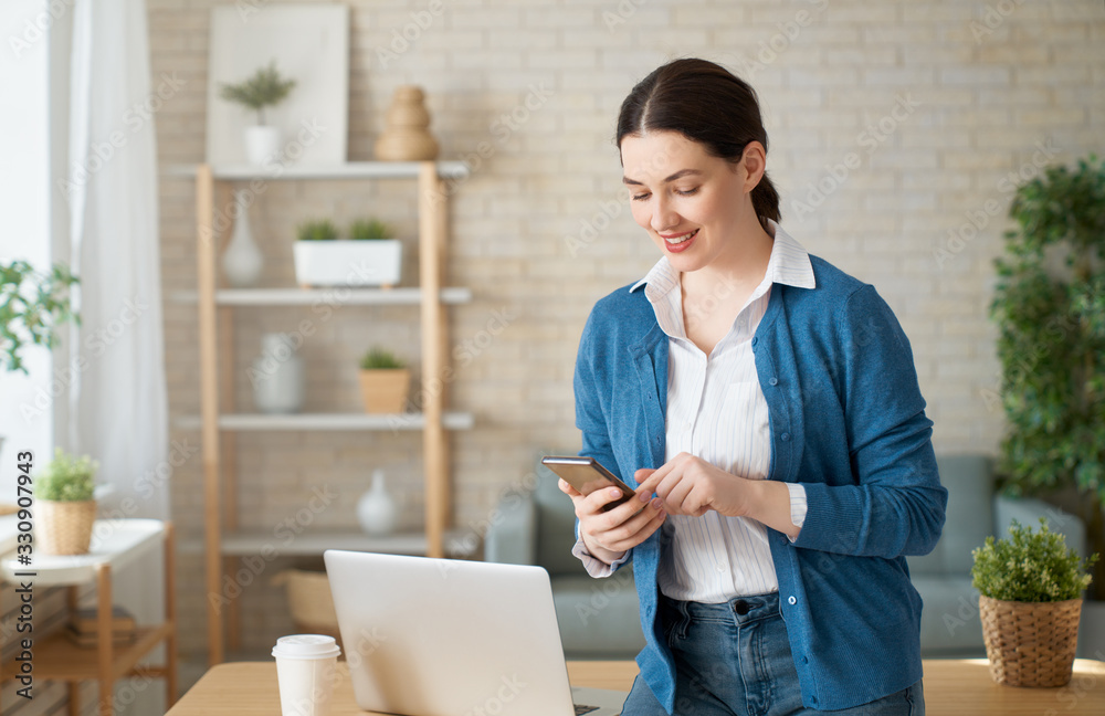 woman working on a laptop at home.