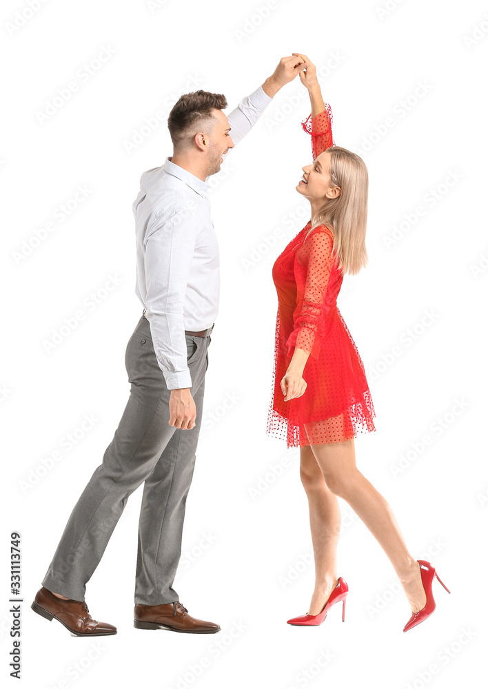 Happy dancing young couple on white background