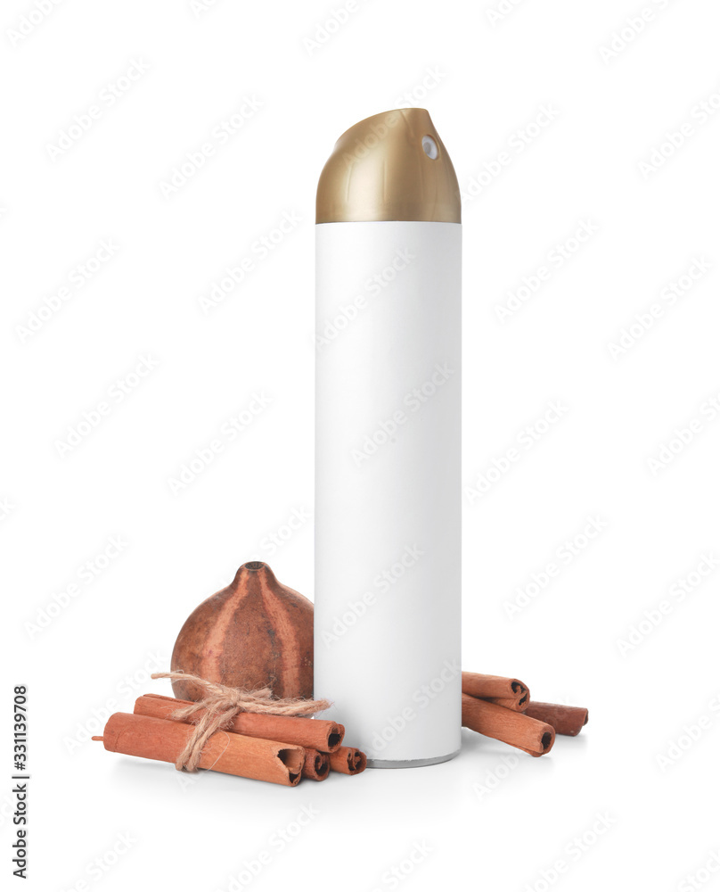 Bottle of air freshener and cinnamon on white background