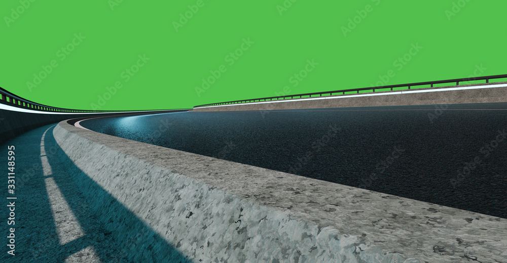 Low angle view of curve asphalt road at night