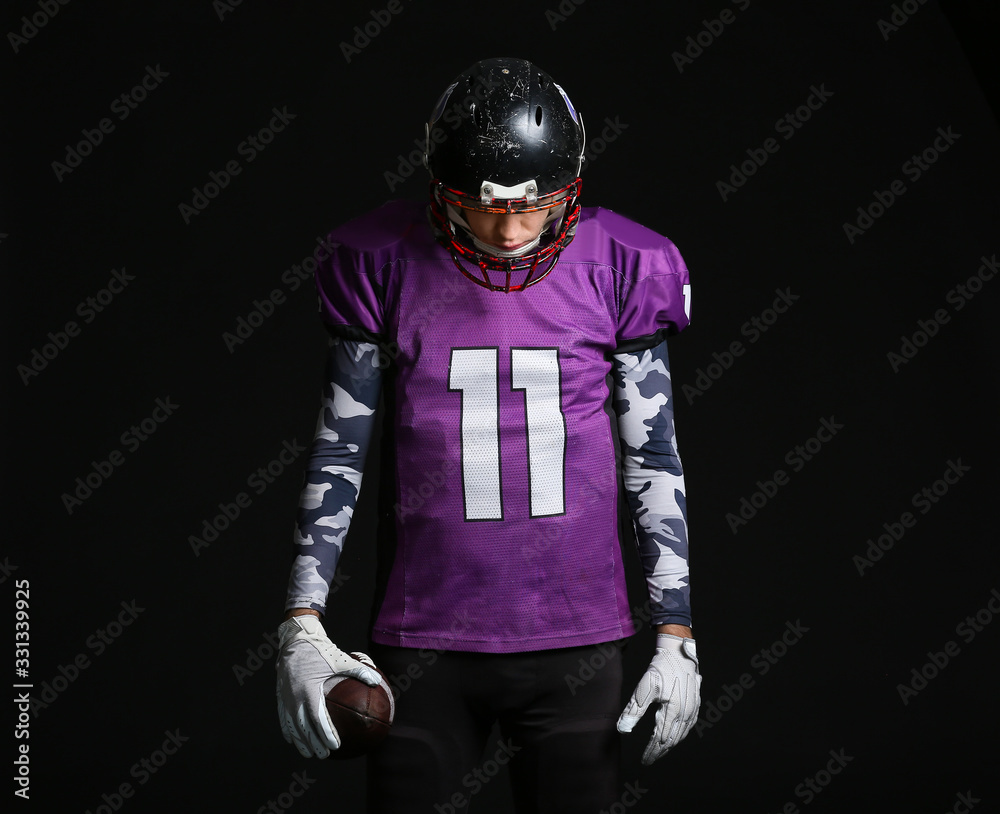 American football player on dark background