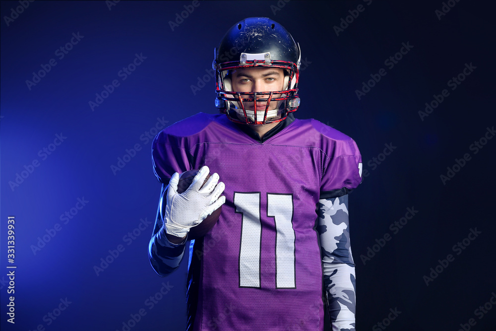 American football player on dark background