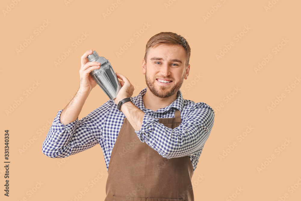 Handsome male bartender on color background