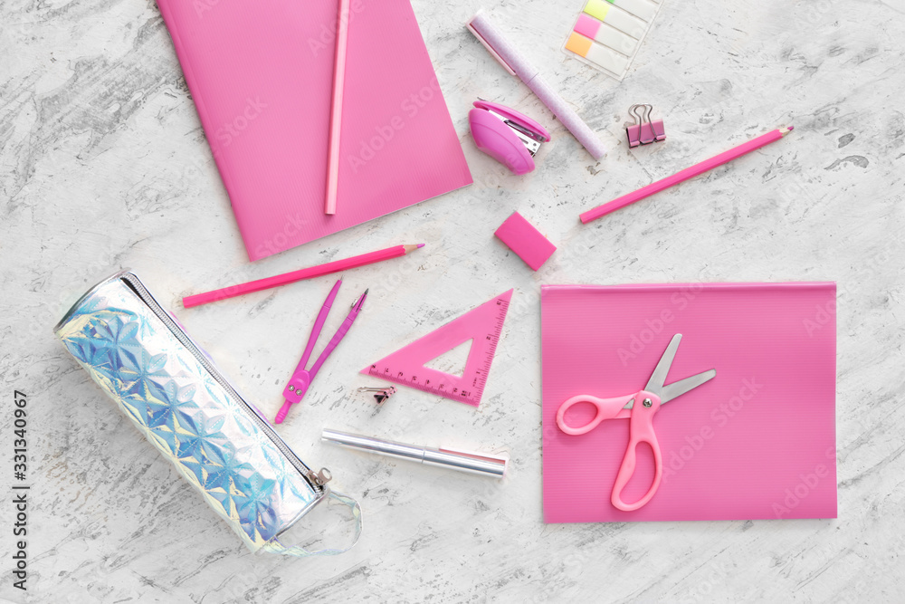 Pencil case and school stationery on light background